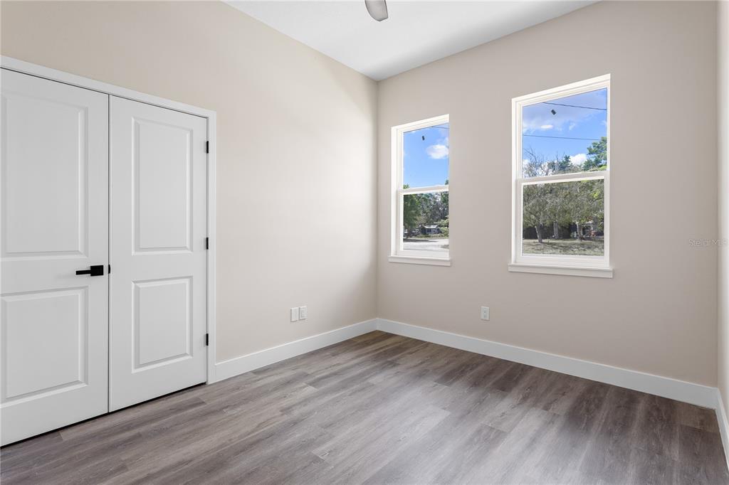 33328 County Road 473 Leesburg, FL 34788 - Photo 13 of 28 a view of an empty room with wooden floor and a window