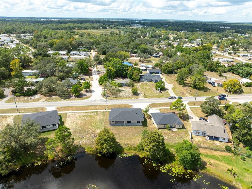 33328 County Road 473 Leesburg, FL 34788 - Photo 19 of 28 an aerial view of residential houses with outdoor space