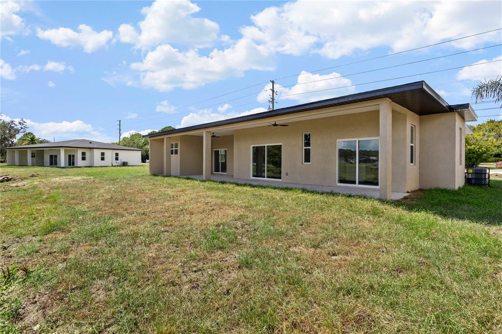 33328 County Road 473 Leesburg, FL 34788 - Photo 21 of 28 a view of a house with backyard and garden