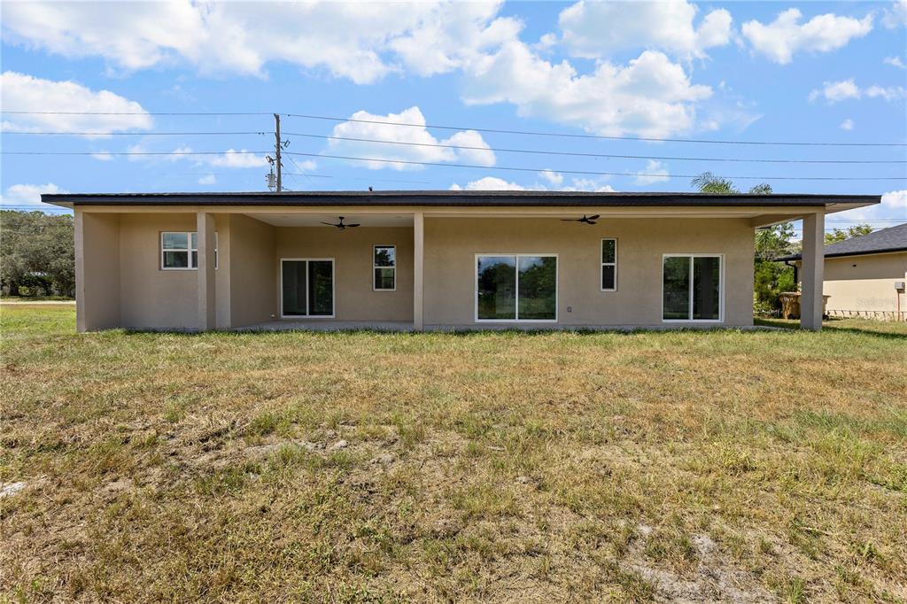 33328 County Road 473 Leesburg, FL 34788 - Photo 22 of 28 a view of a house with a yard