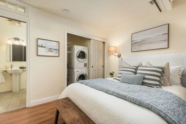 a bedroom with a bed and a view of bathroom