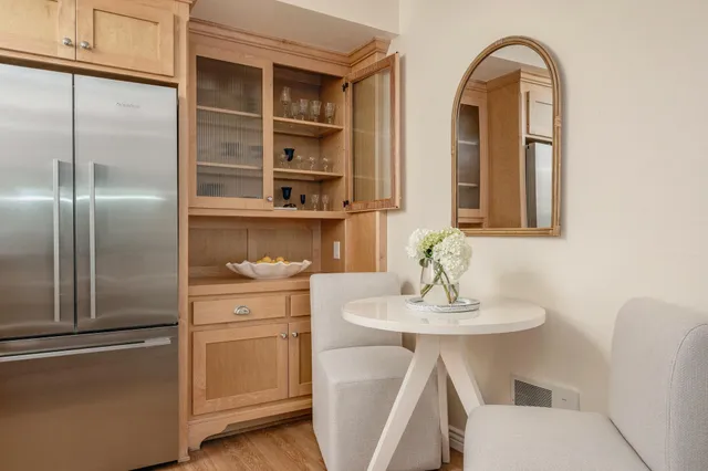 a kitchen with stainless steel appliances a sink and cabinets