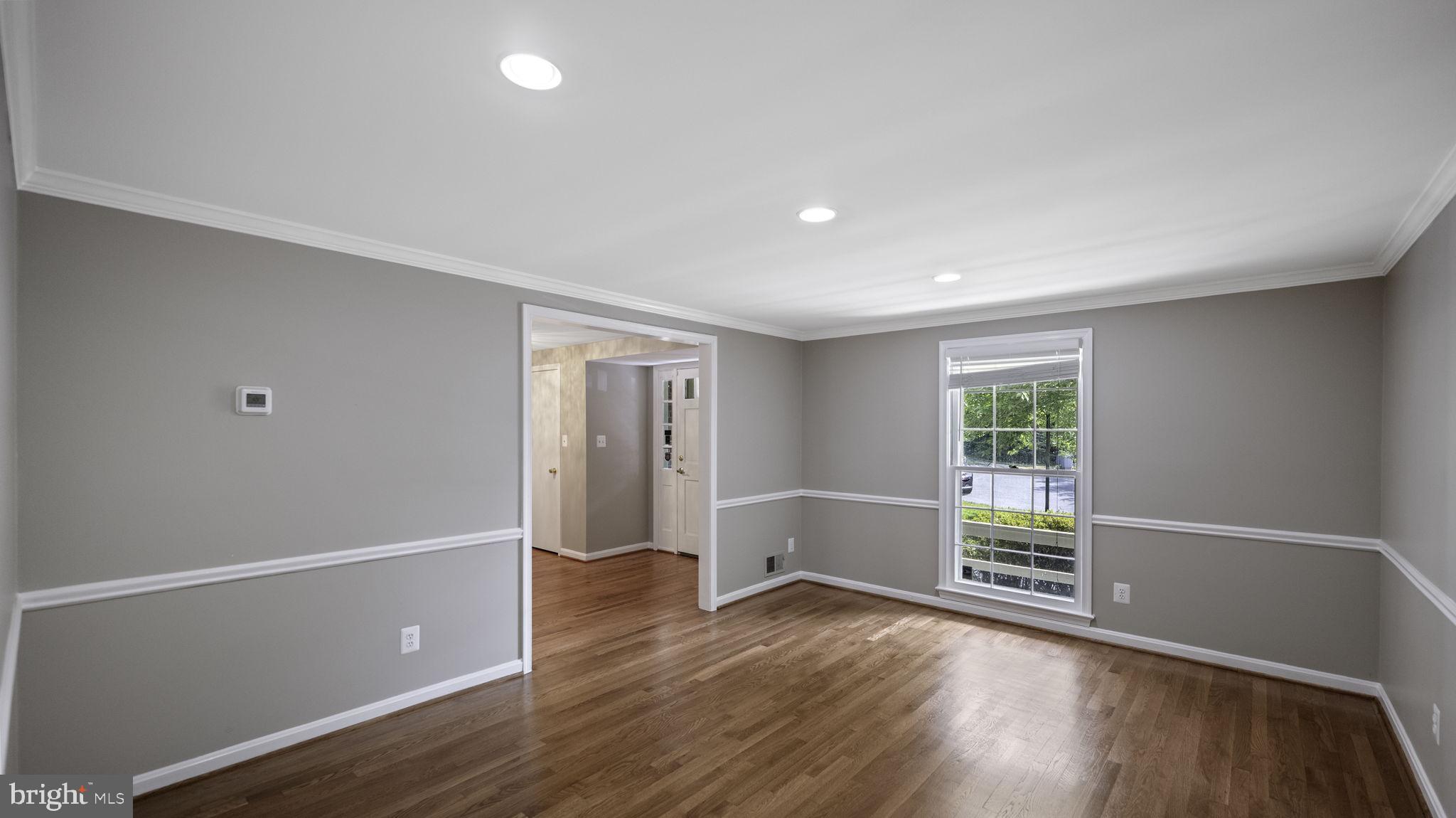 9705 Eclipse Place Montgomery Village, MD 20886 - Photo 15 of 54 an empty room with wooden floor and windows