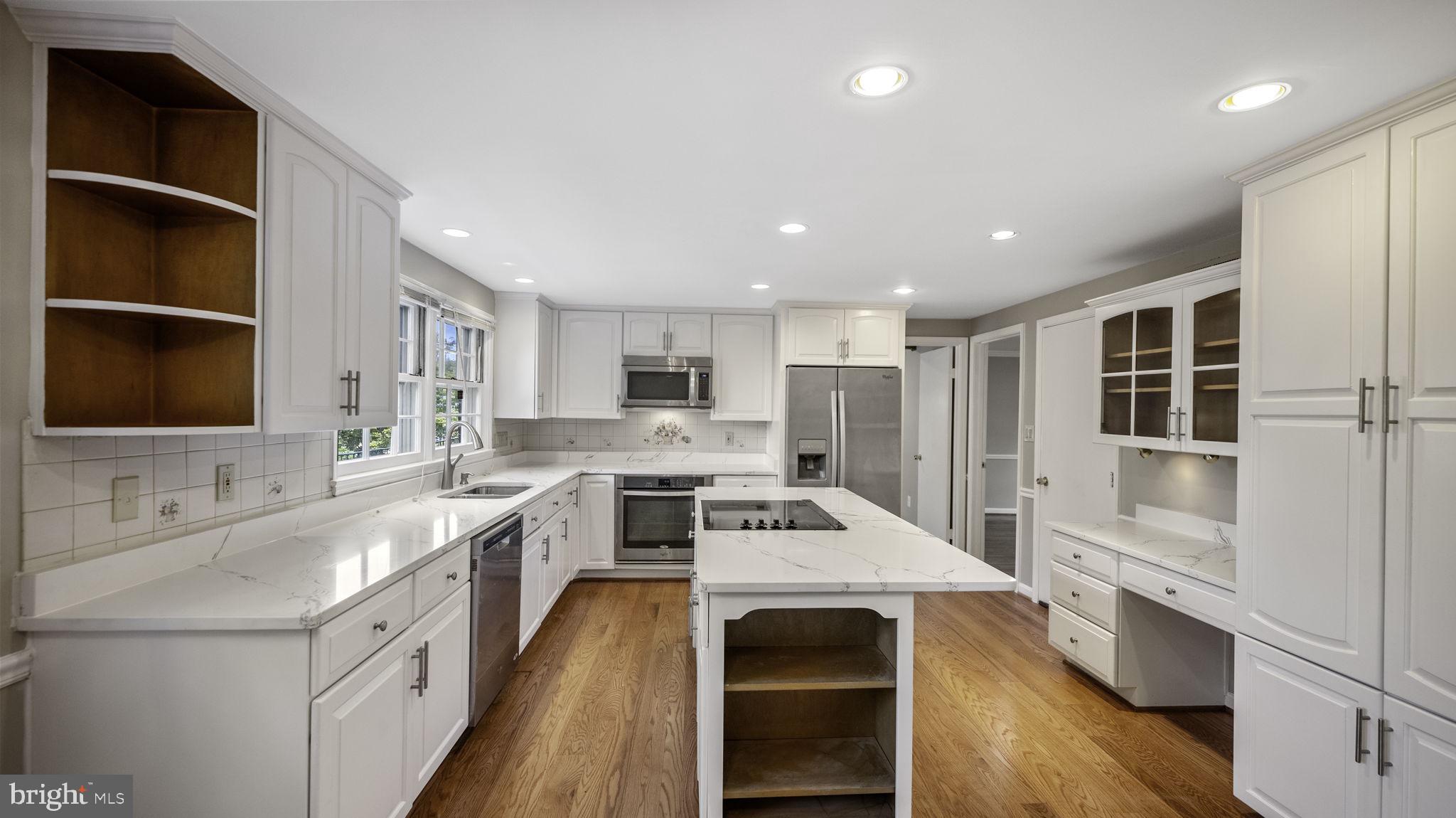 9705 Eclipse Place Montgomery Village, MD 20886 - Photo 18 of 54 a large white kitchen with a stove top oven