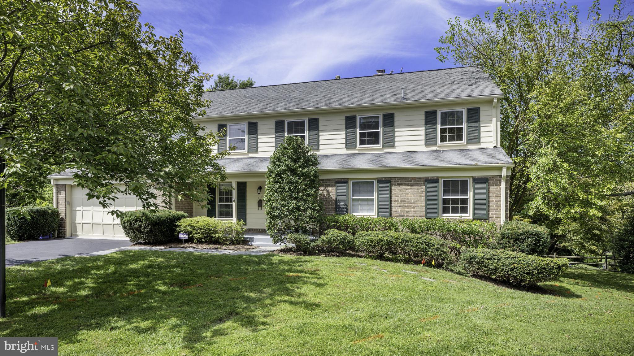 9705 Eclipse Place Montgomery Village, MD 20886 - Photo 3 of 54 a front view of a house with garden