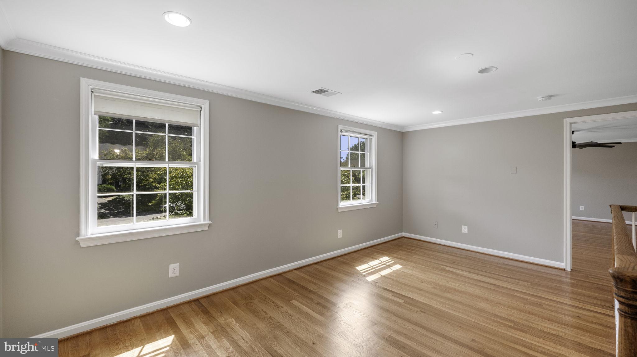 9705 Eclipse Place Montgomery Village, MD 20886 - Photo 33 of 54 a view of empty room with wooden floor and fan