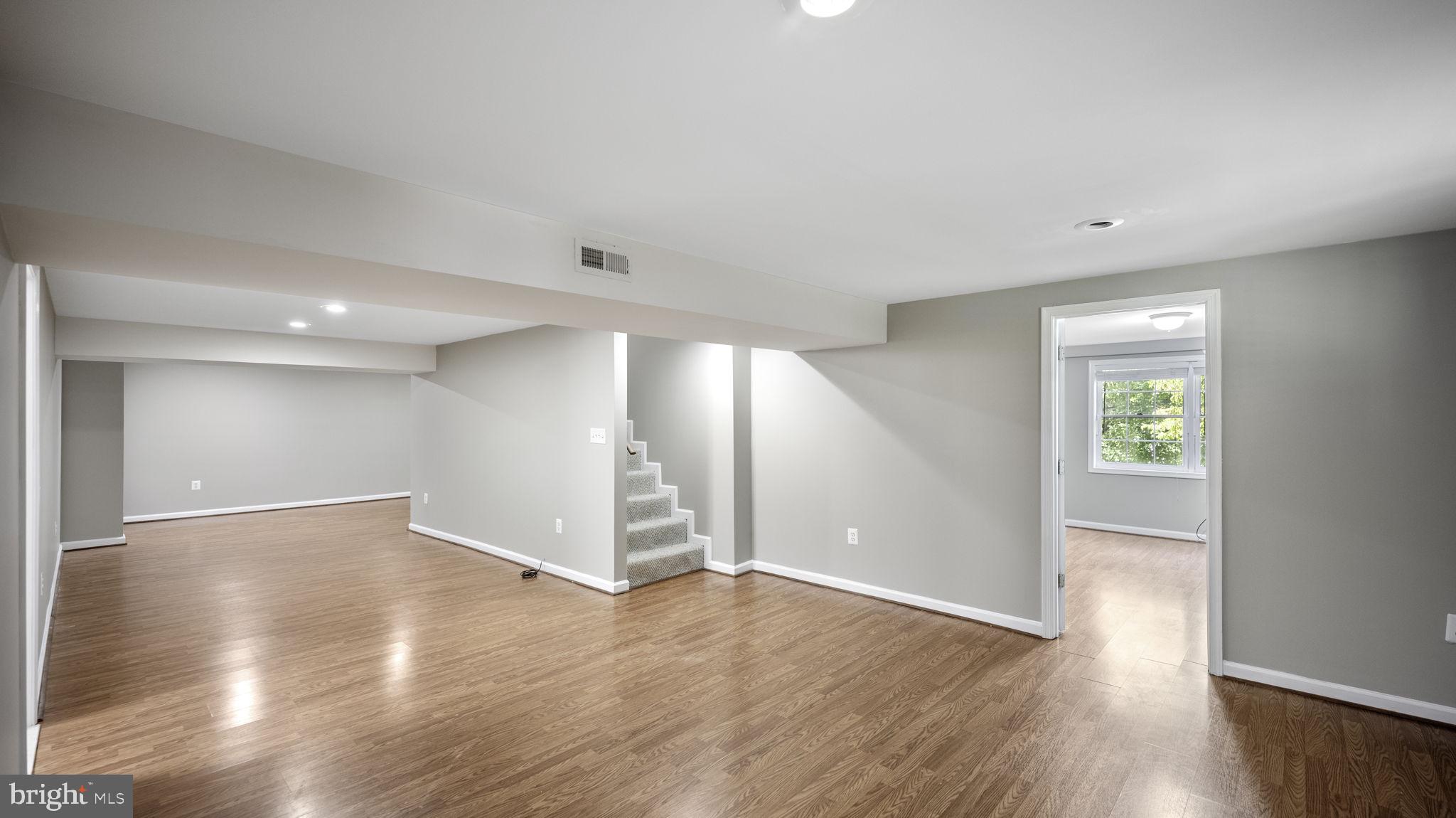 9705 Eclipse Place Montgomery Village, MD 20886 - Photo 42 of 54 a view of empty room with wooden floor