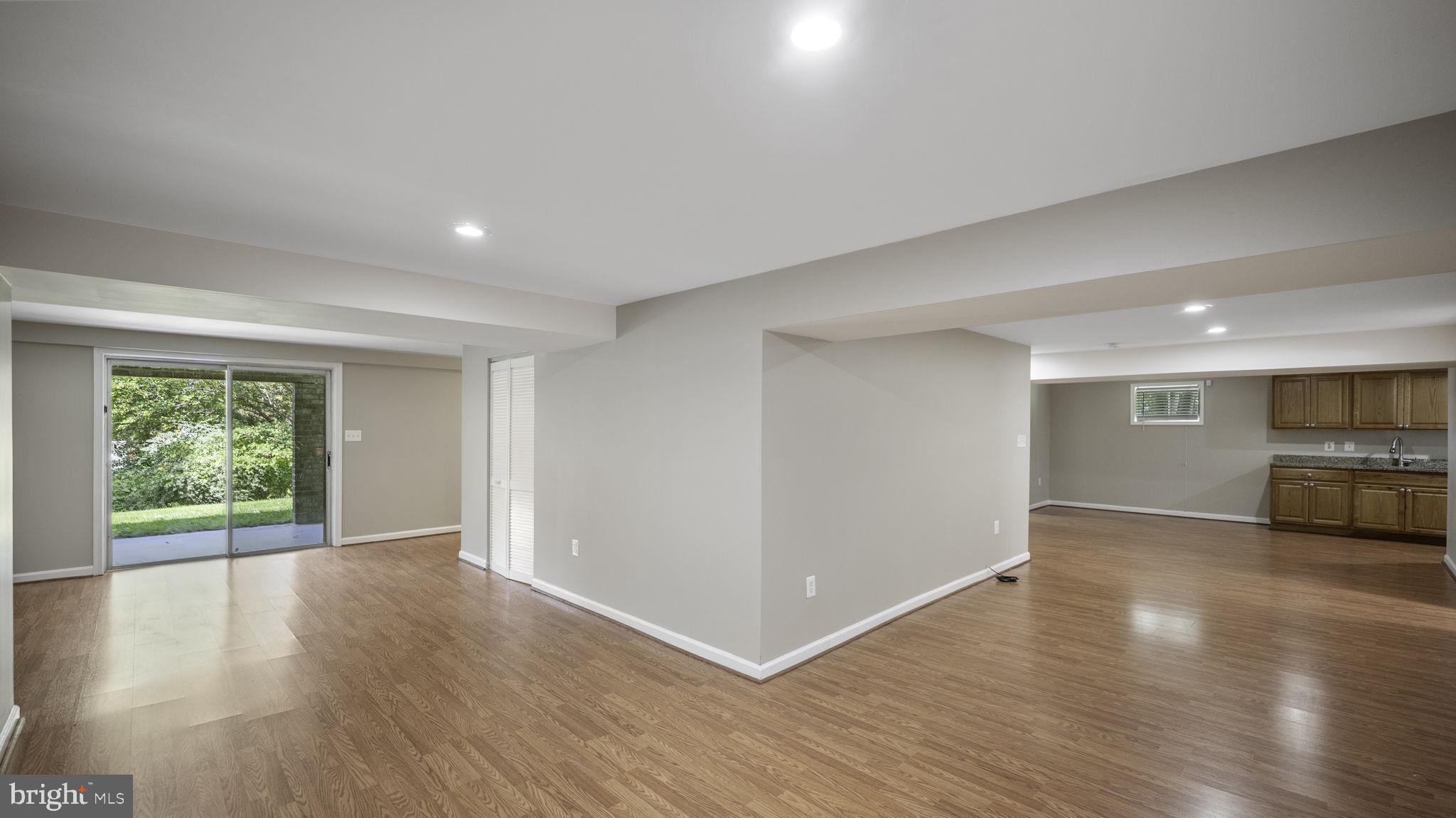 9705 Eclipse Place Montgomery Village, MD 20886 - Photo 43 of 54 a view of empty room with wooden floor and fan