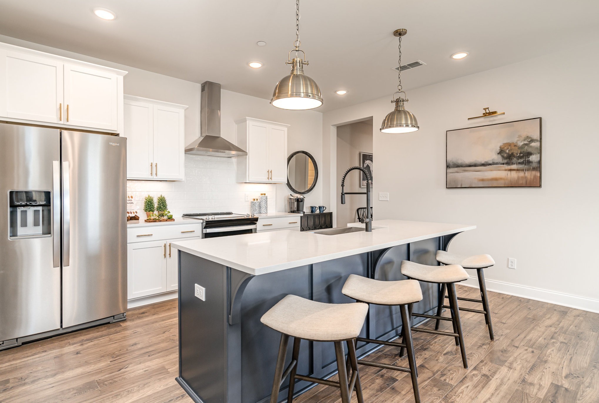 1234 Wrights Mill Road Spring Hill, TN 37174 - Photo 5 of 21 a kitchen with stainless steel appliances a dining table chairs stove and refrigerator