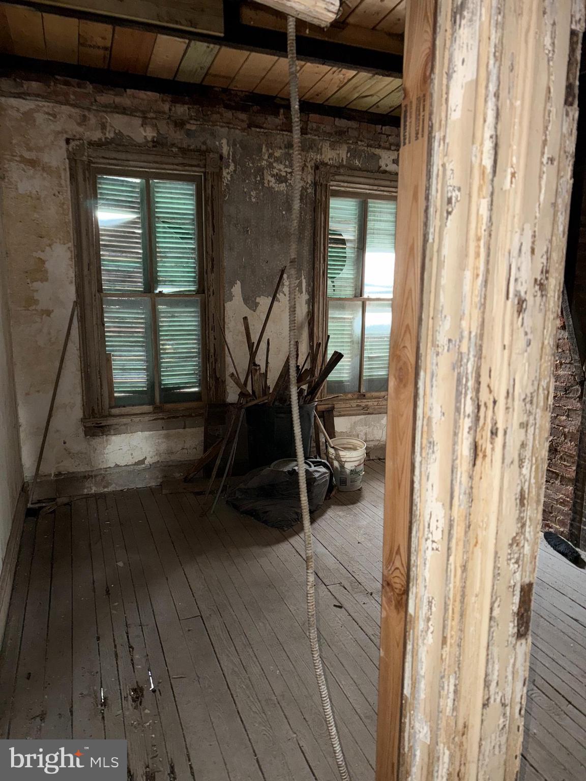 2422 Federal Street Baltimore, MD 21213 - Photo 16 of 19 a view of a room with wooden floor and furniture