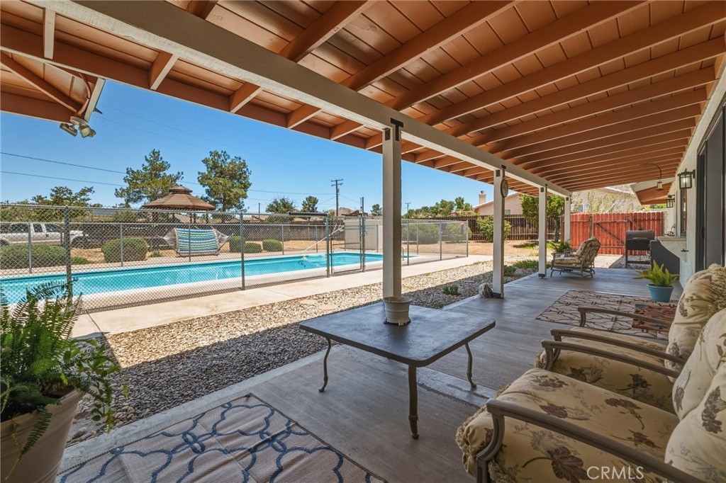 16230 St Timothy Road Apple Valley, CA 92307 - Photo 44 of 51 Back covered patio view to pool