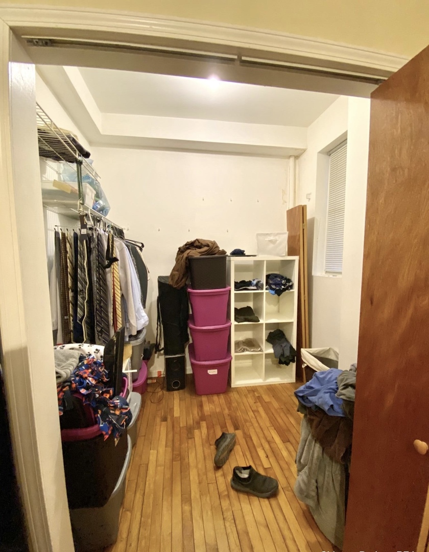 2610 West Thomas Street, Unit 1F Chicago, IL 60622 - Photo 12 of 13 a bed room with a bed and walk in closet