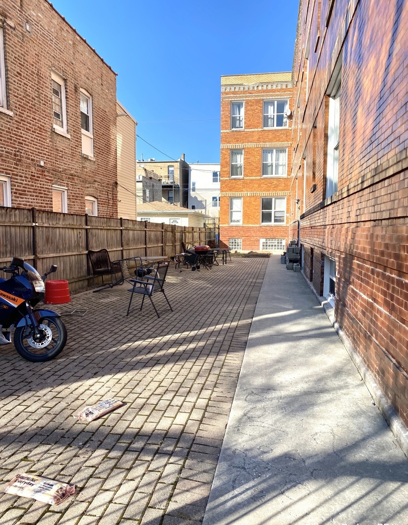 2610 West Thomas Street, Unit 1F Chicago, IL 60622 - Photo 13 of 13 a view of a car park in front of a building