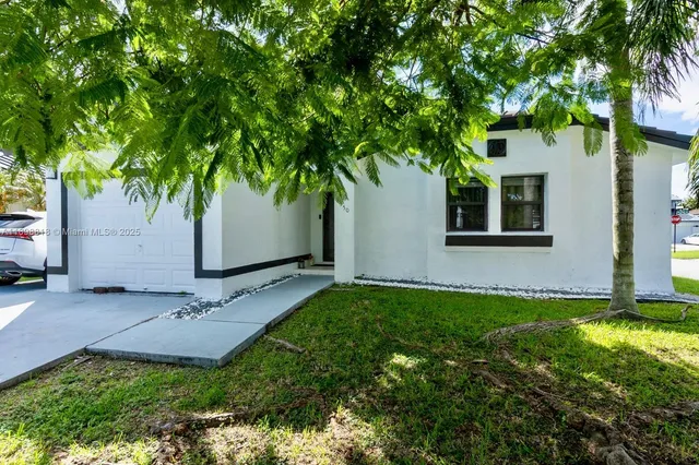 a backyard of a house with lots of green space