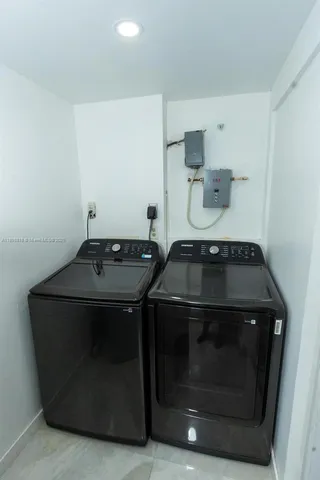 a stove top oven sitting inside of a kitchen