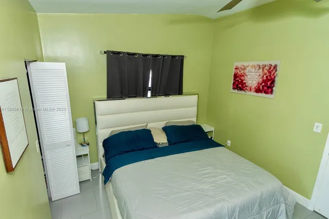 a bedroom with a bed and furniture