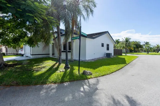 a house with sign in front of it