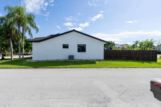 a view of backyard with green space