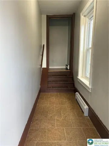 a view of entryway with a rug and a window
