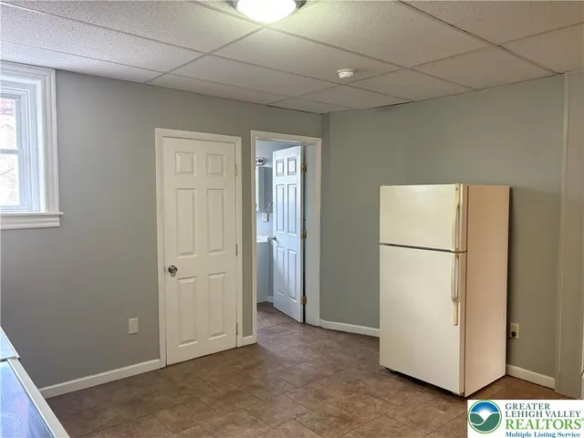 a view of a storage & utility room with closet window
