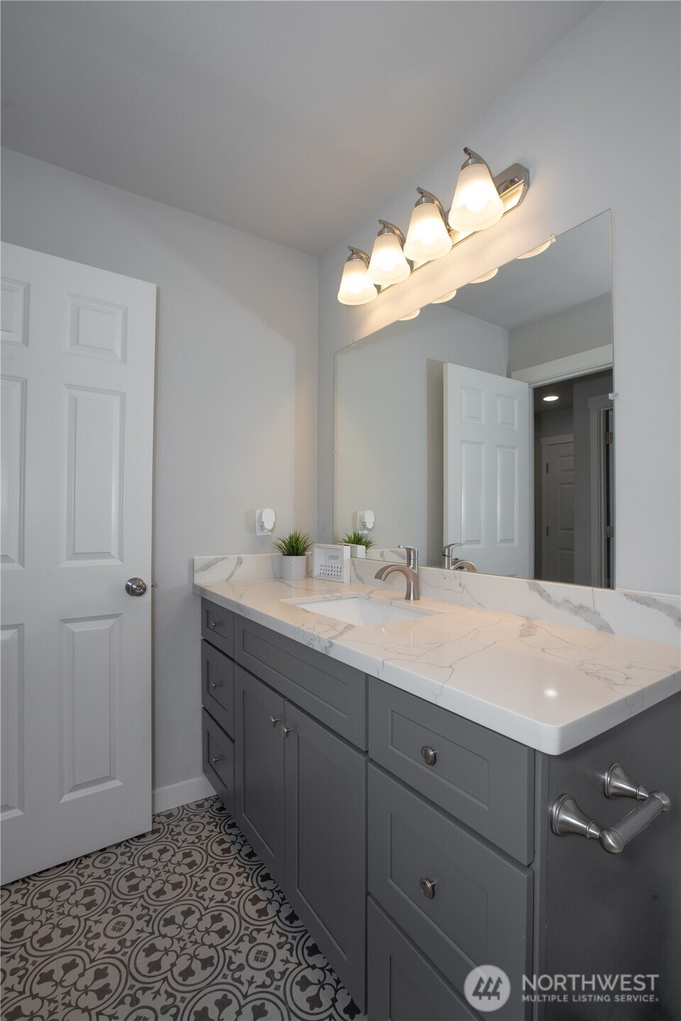 17643 Loop Lane Southeast Yelm, WA 98597 - Photo 14 of 33 a bathroom with a sink vanity and a mirror