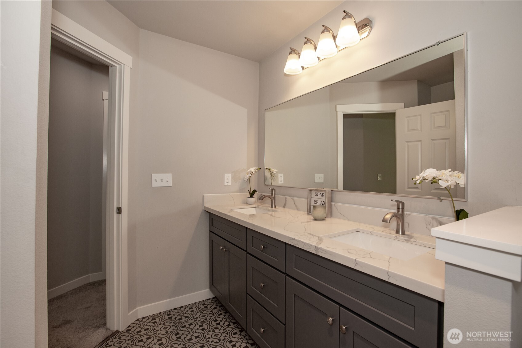 17643 Loop Lane Southeast Yelm, WA 98597 - Photo 26 of 33 a bathroom with a double vanity sink and a mirror