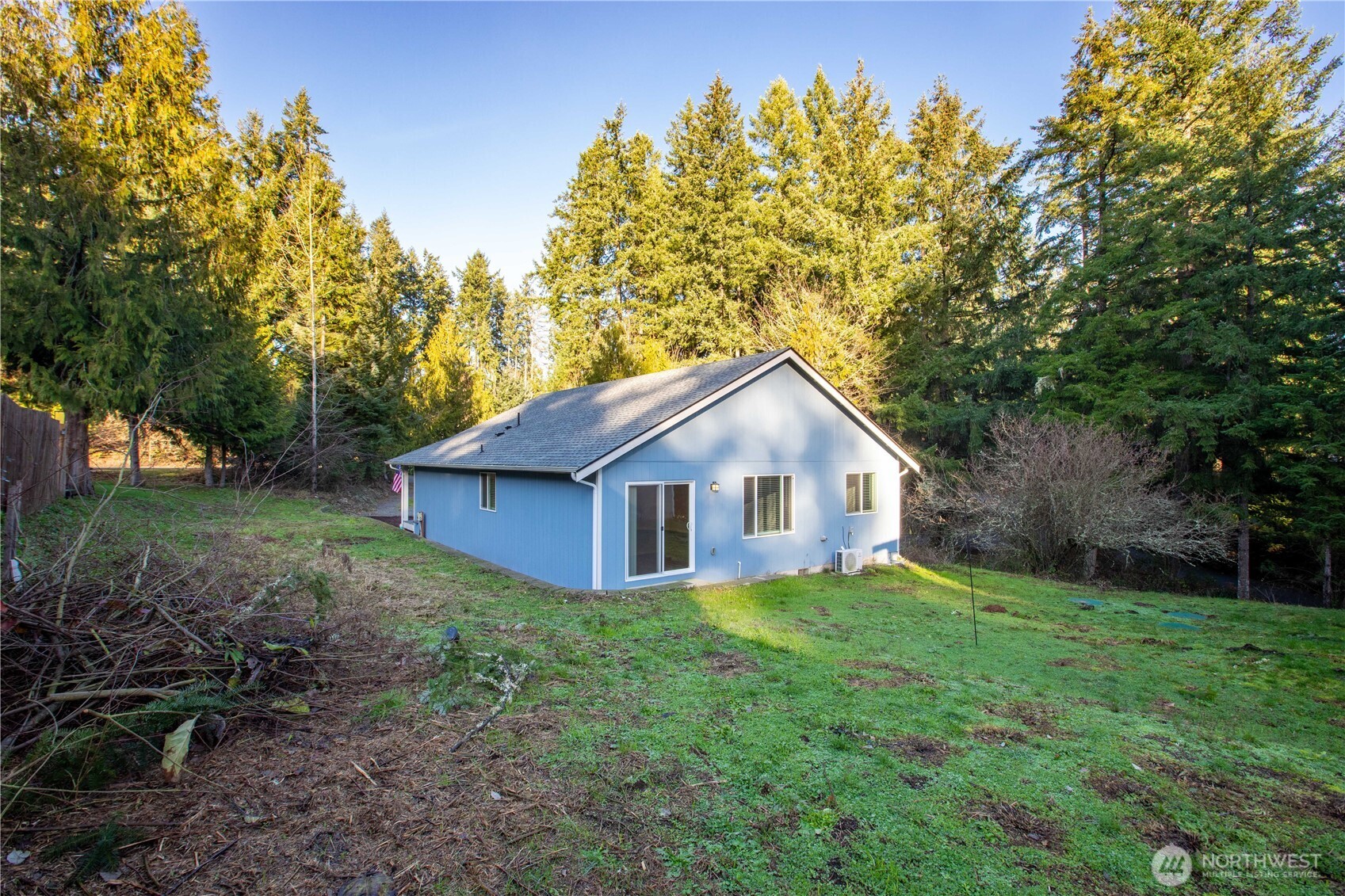 17643 Loop Lane Southeast Yelm, WA 98597 - Photo 30 of 33 a view of a house with yard and a garden
