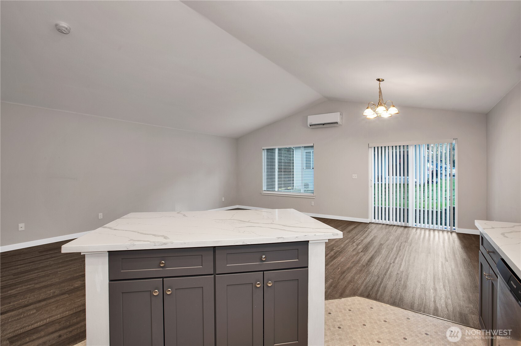 17643 Loop Lane Southeast Yelm, WA 98597 - Photo 10 of 33 a room with a wooden floor and white cabinets