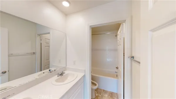 a close view of a bathroom sink and a toilet
