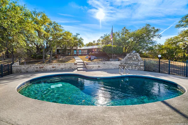 a view of a swimming pool with a sitting space