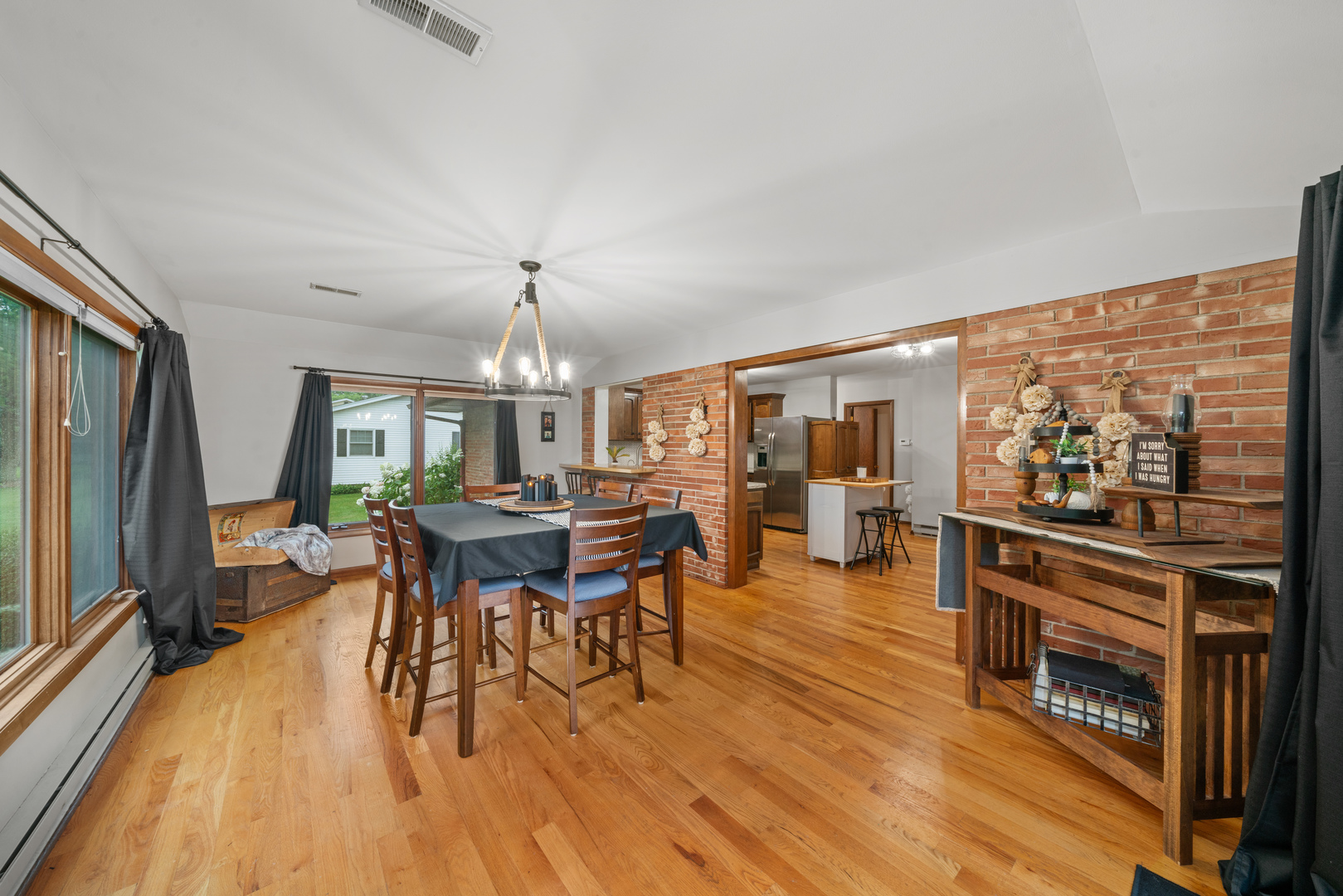 1102 Vale Street Sandwich, IL 60548 - Photo 16 of 44 a view of a dining room with furniture window and wooden floor