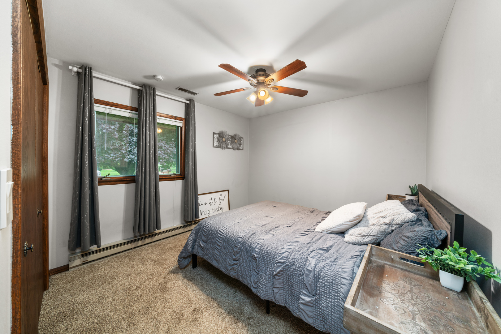 1102 Vale Street Sandwich, IL 60548 - Photo 18 of 44 a bedroom with a bed and a chandelier