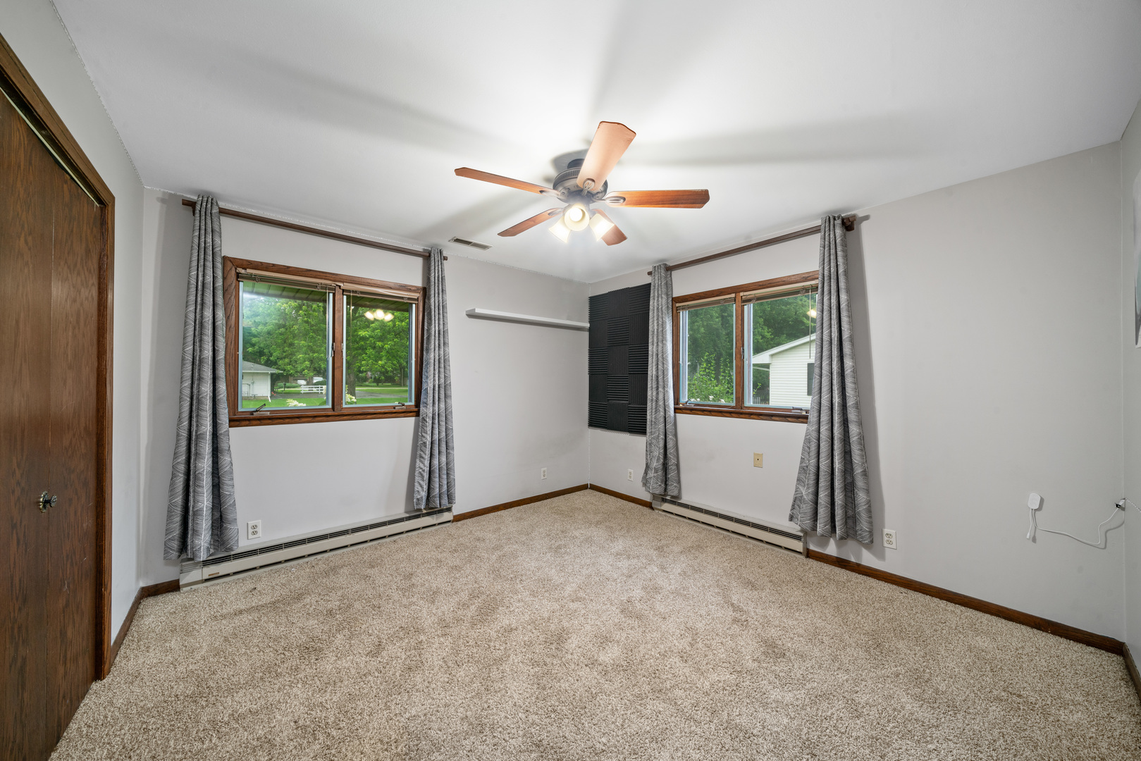 1102 Vale Street Sandwich, IL 60548 - Photo 20 of 44 an empty room with windows and ceiling fan