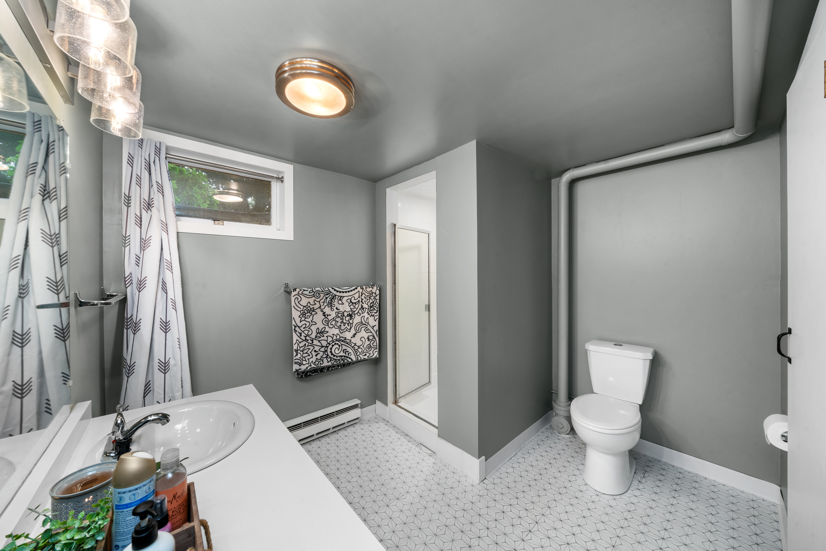 1102 Vale Street Sandwich, IL 60548 - Photo 25 of 44 a bathroom with a toilet sink and shower