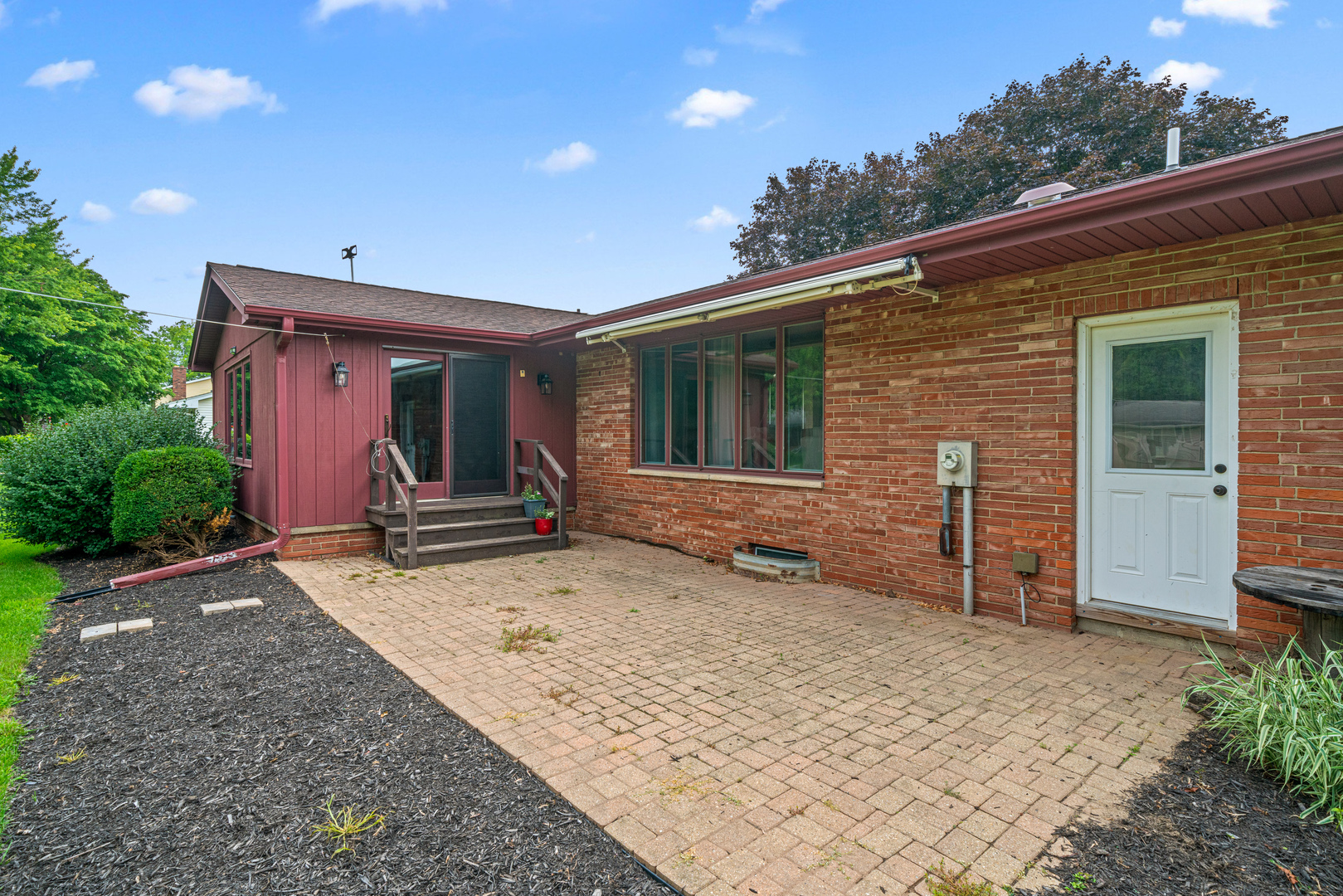 1102 Vale Street Sandwich, IL 60548 - Photo 31 of 44 a front view of a house with a yard and garage