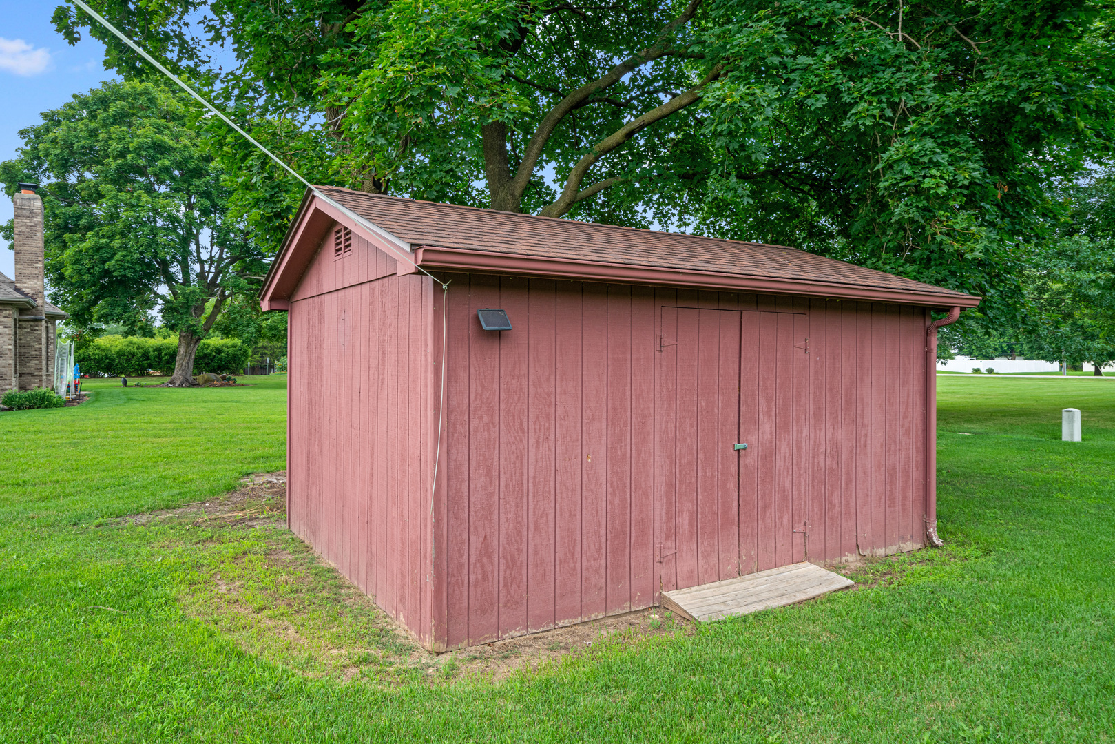 1102 Vale Street Sandwich, IL 60548 - Photo 35 of 44 a backyard of a house with lots of green space