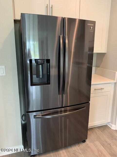 182 Holly Forest Drive St. Augustine, FL 32092 - Photo 11 of 29 a metallic refrigerator freezer sitting in a kitchen