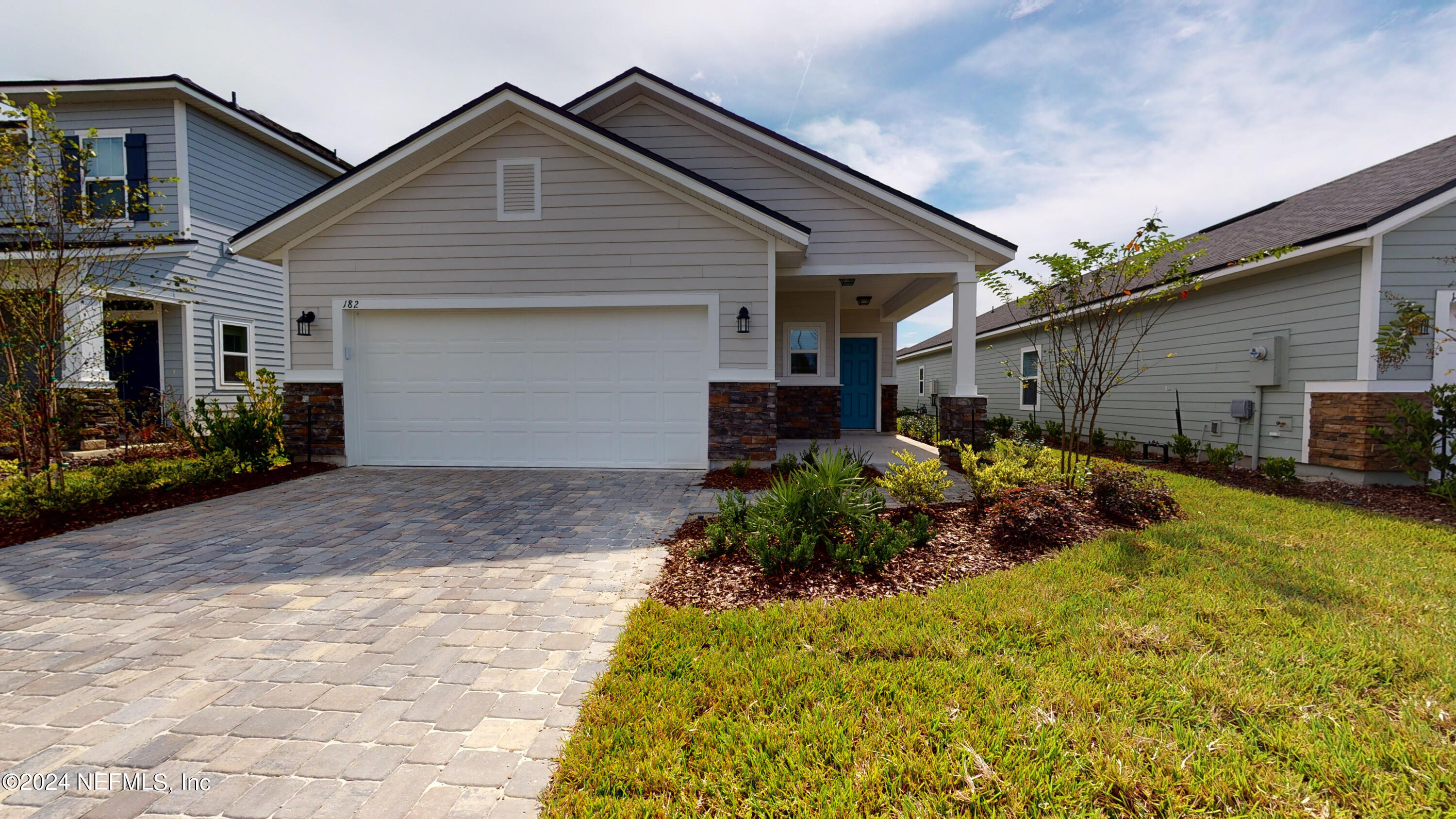 182 Holly Forest Drive St. Augustine, FL 32092 - Photo 2 of 29 a front view of house with yard and trees around
