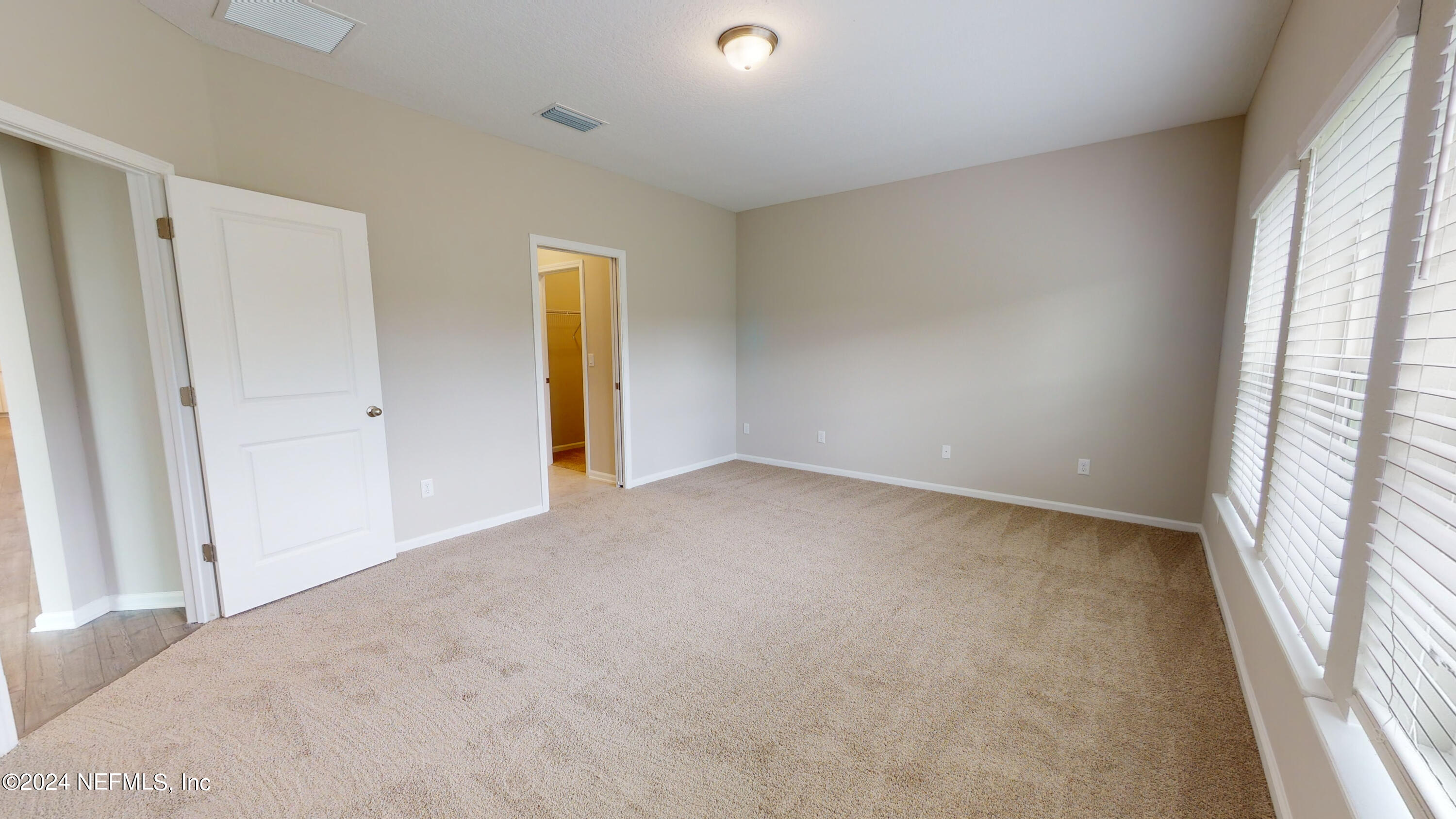 182 Holly Forest Drive St. Augustine, FL 32092 - Photo 21 of 29 a view of an empty room and a window