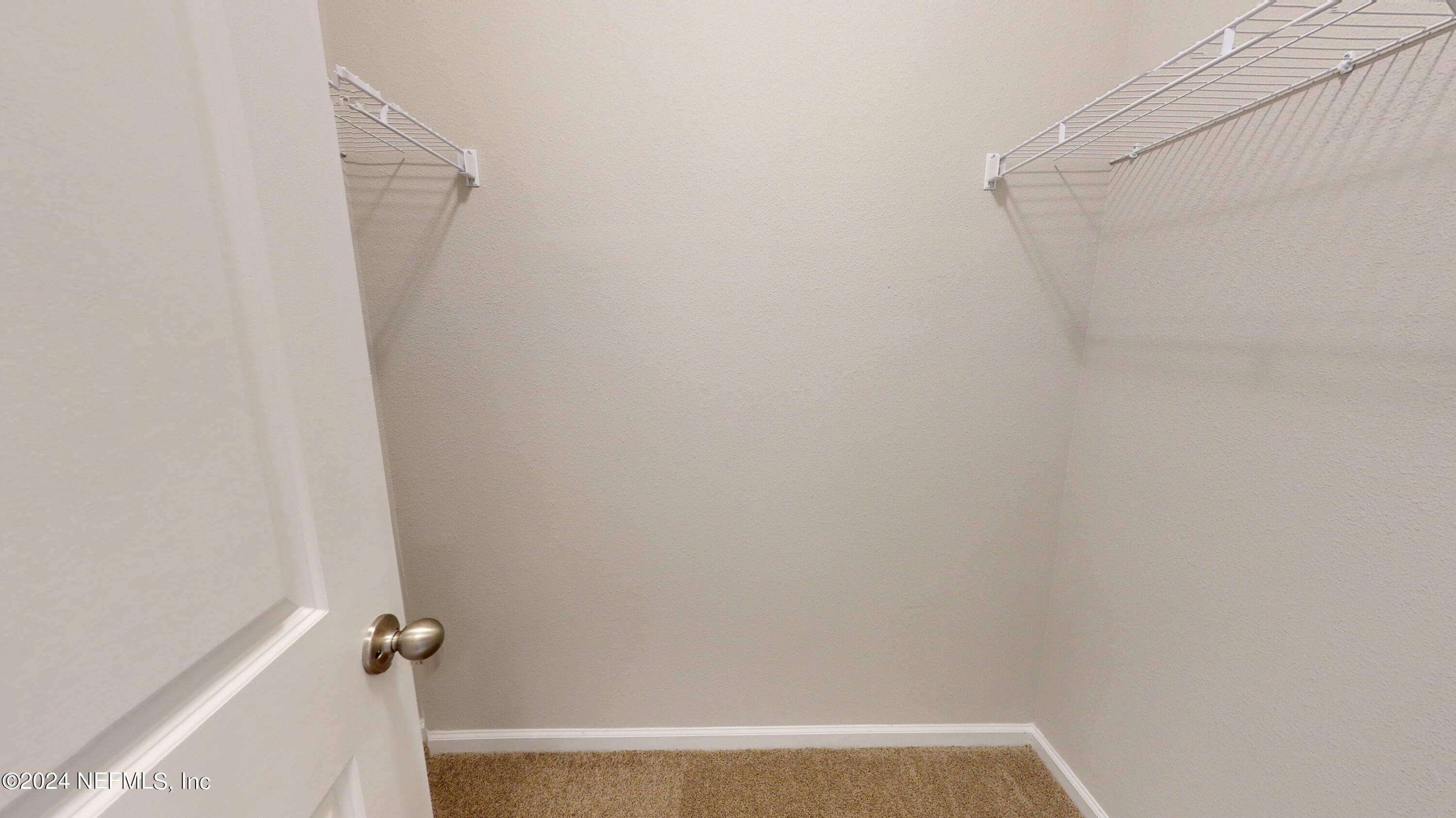 182 Holly Forest Drive St. Augustine, FL 32092 - Photo 23 of 29 a view of small space with racks on the wall