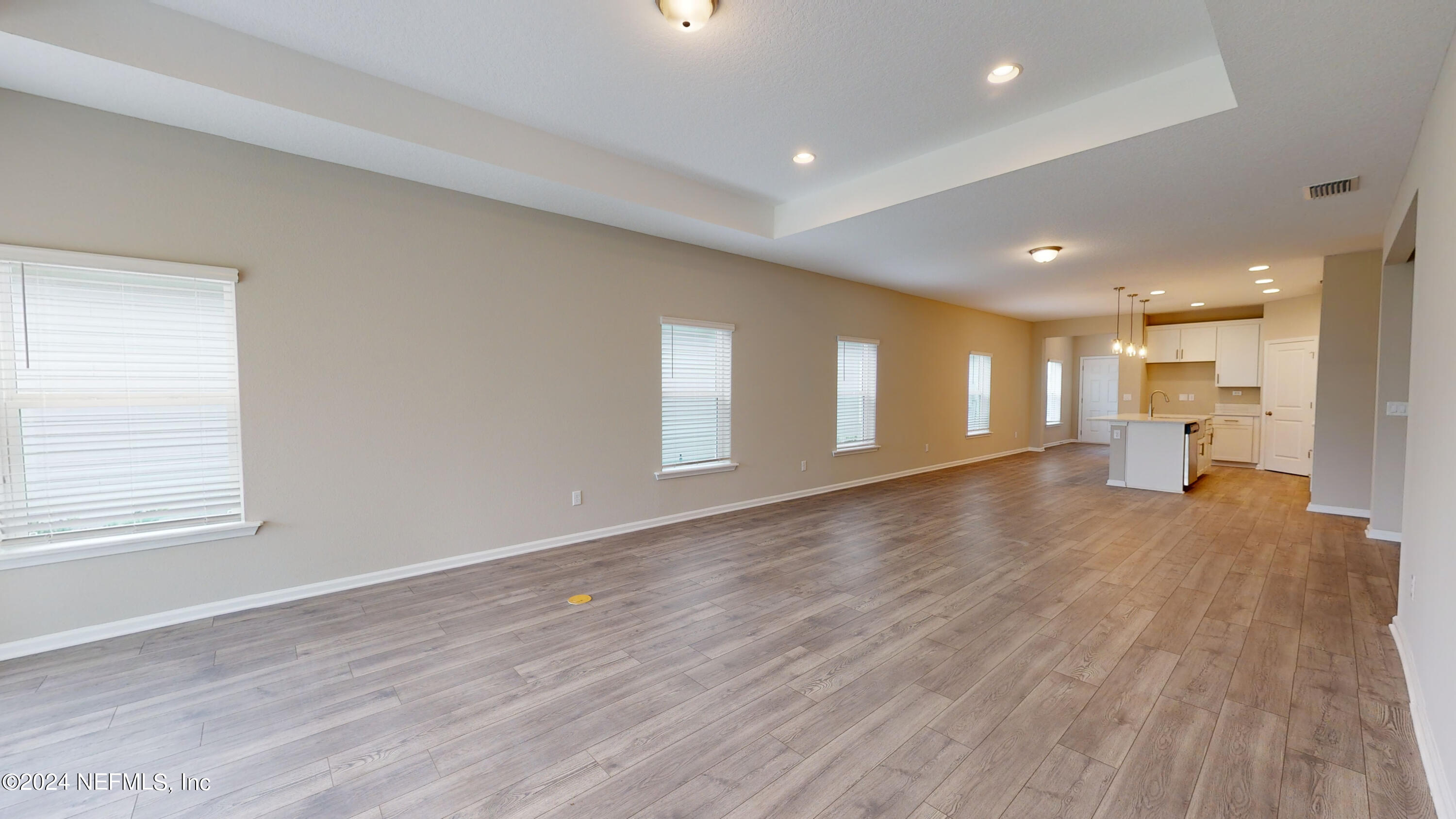 182 Holly Forest Drive St. Augustine, FL 32092 - Photo 26 of 29 a view of empty room with wooden floor