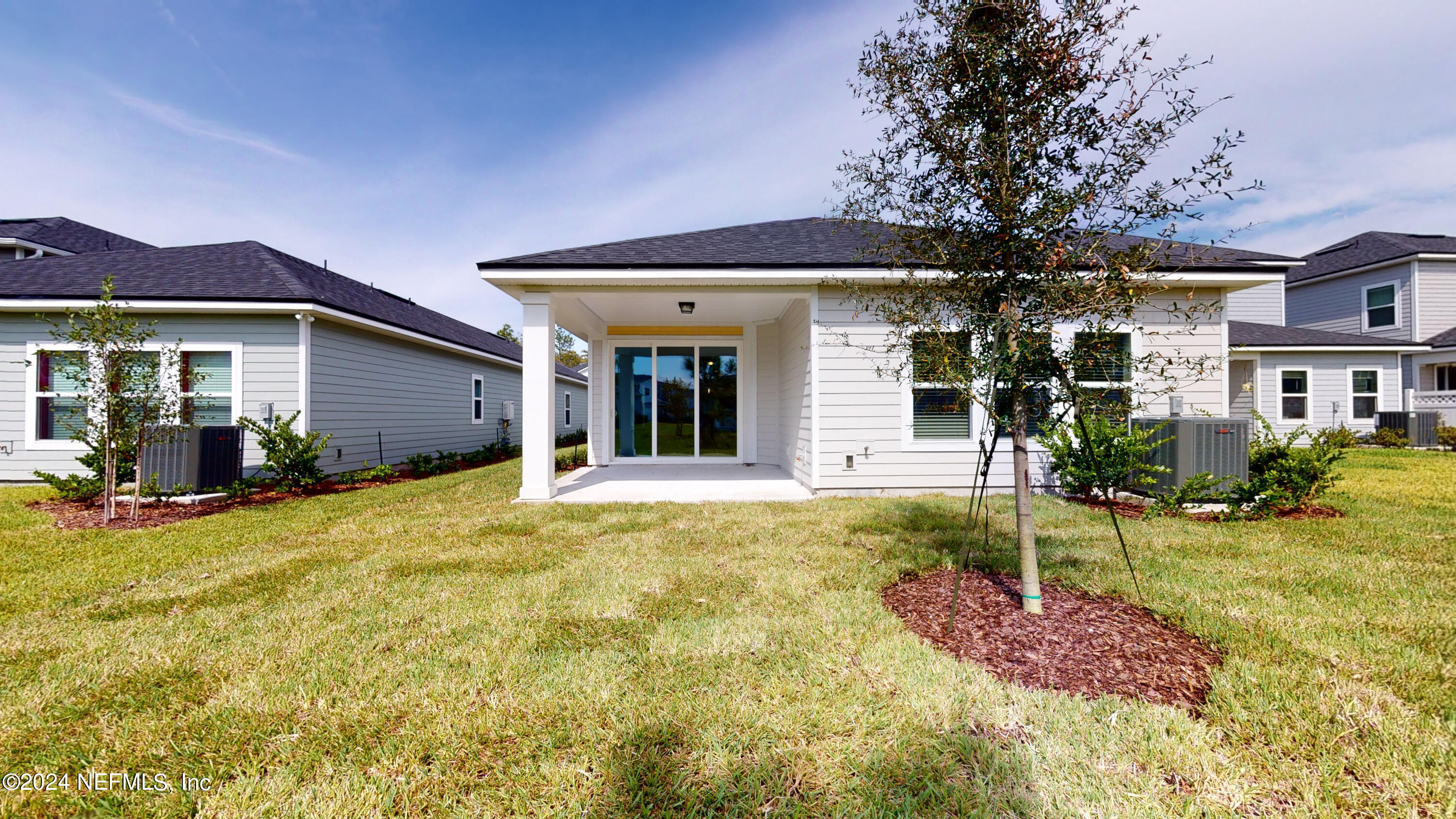 182 Holly Forest Drive St. Augustine, FL 32092 - Photo 28 of 29 a view of a house with backyard porch and sitting area