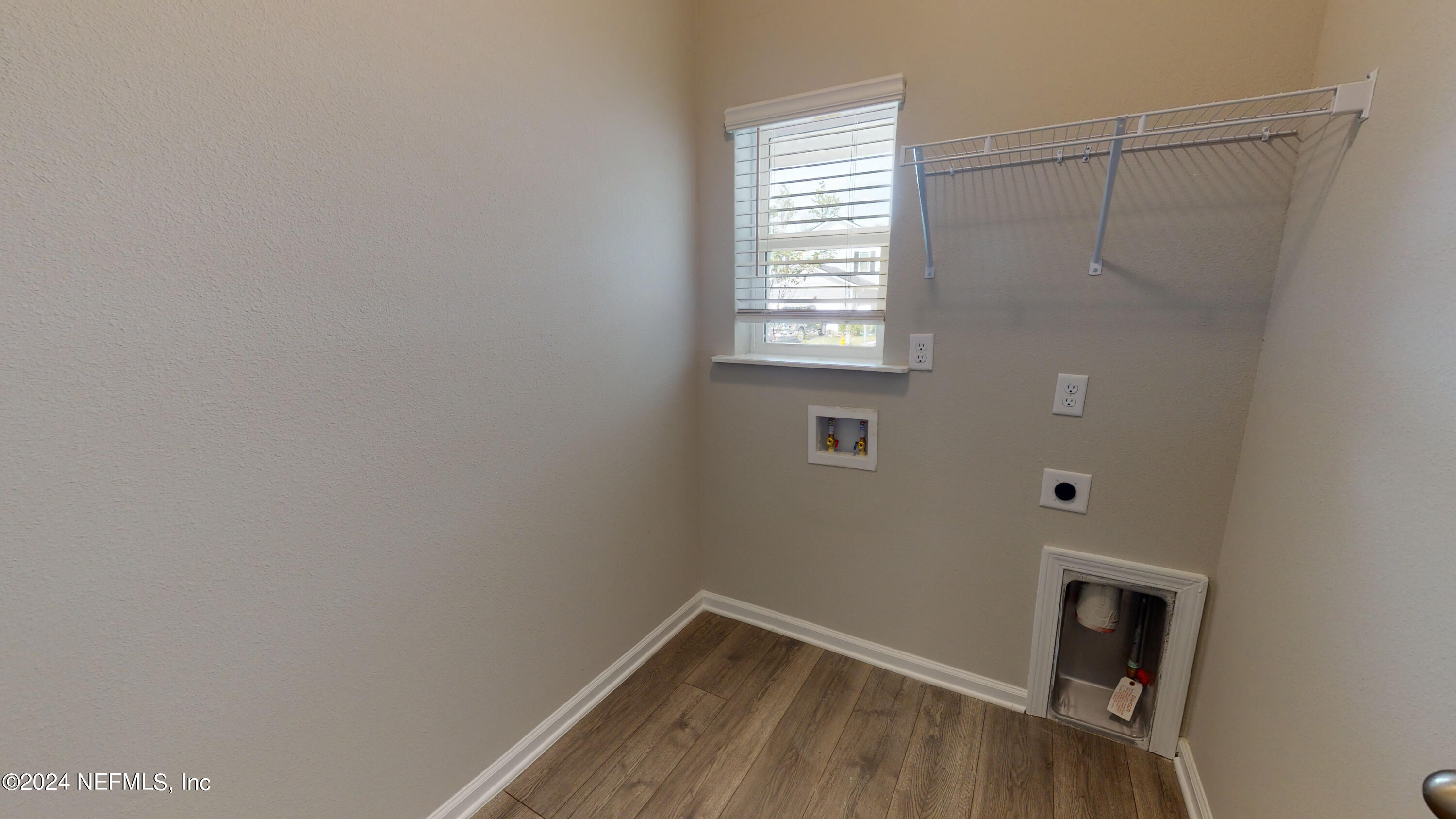 182 Holly Forest Drive St. Augustine, FL 32092 - Photo 5 of 29 a view of a small space with wooden floor and a window
