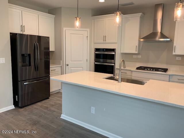 182 Holly Forest Drive St. Augustine, FL 32092 - Photo 7 of 29 a kitchen with stainless steel appliances a refrigerator a stove a sink and a refrigerator