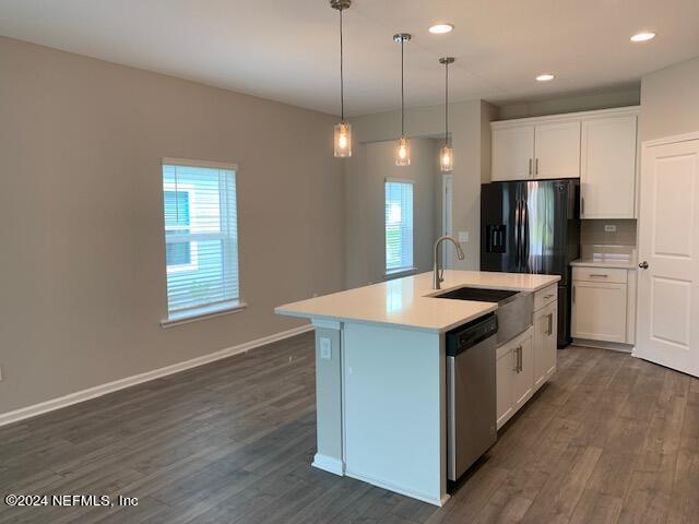 182 Holly Forest Drive St. Augustine, FL 32092 - Photo 8 of 29 a kitchen with stainless steel appliances granite countertop a sink a stove a refrigerator and a oven with wooden floor