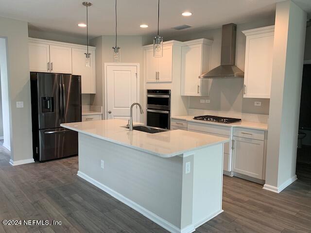 182 Holly Forest Drive St. Augustine, FL 32092 - Photo 9 of 29 a kitchen with kitchen island a sink stainless steel appliances and cabinets