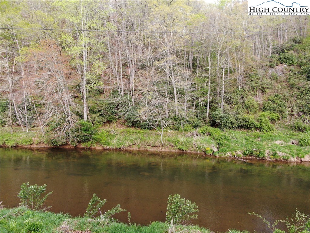 Big Hill Road Todd, NC 28684 - Photo 43 of 45 a view of a lake with a yard and large trees