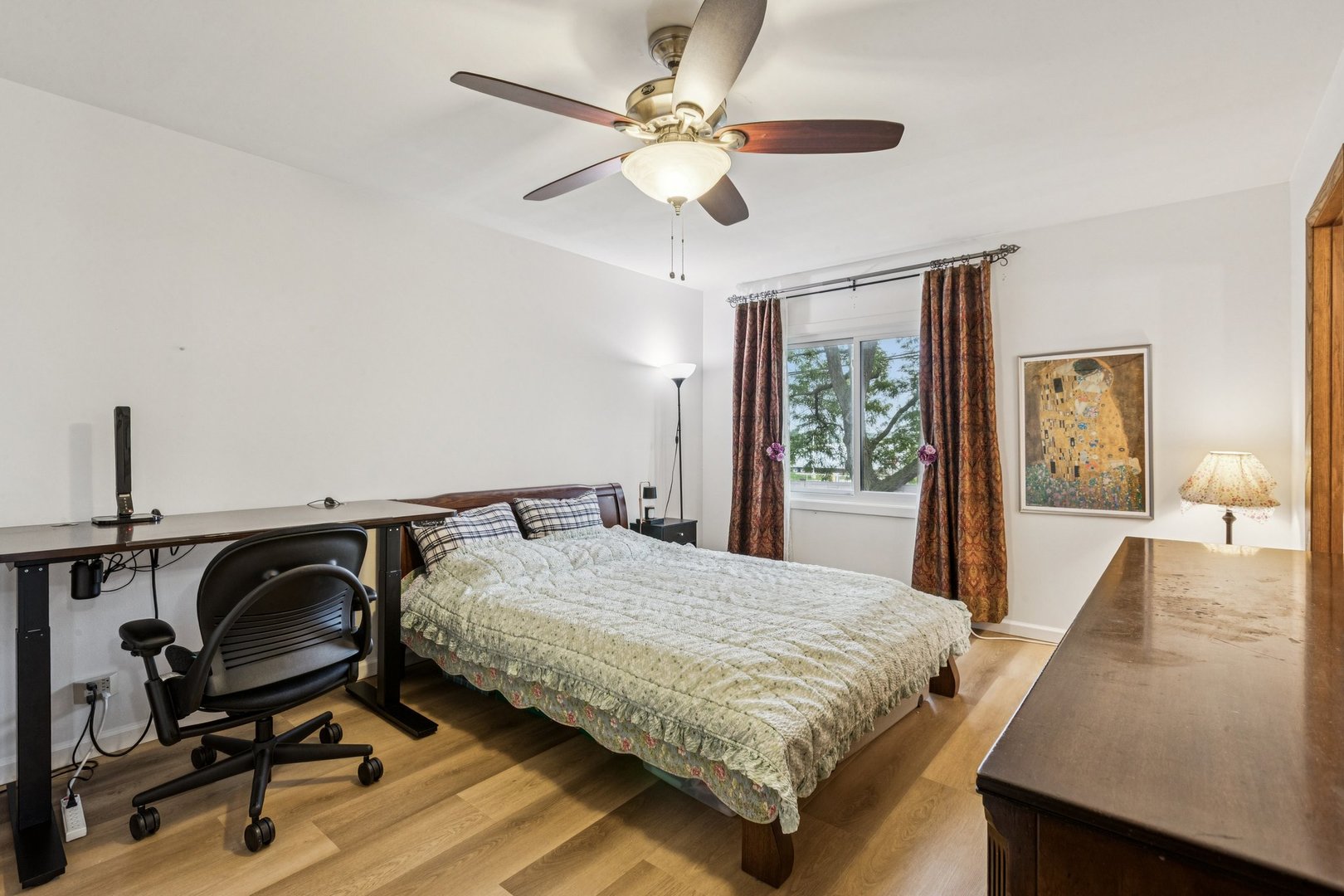 522 East Algonquin Road, Unit 201 Schaumburg, IL 60173 - Photo 21 of 27 a bedroom with a bed and a chandelier