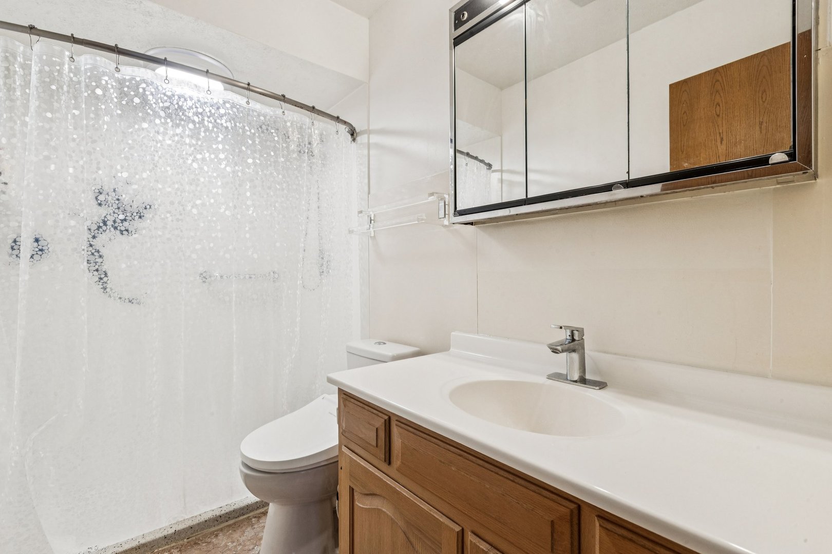 522 East Algonquin Road, Unit 201 Schaumburg, IL 60173 - Photo 23 of 27 a bathroom with a sink a toilet and mirror