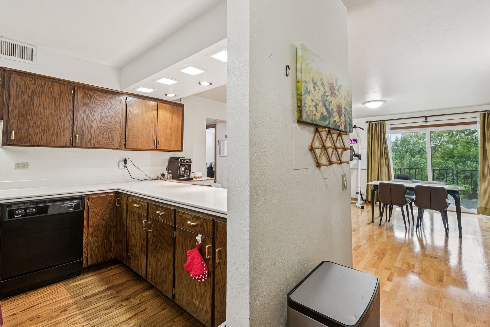 522 East Algonquin Road, Unit 201 Schaumburg, IL 60173 - Photo 9 of 27 a kitchen with wooden cabinets a sink a stove and a refrigerator